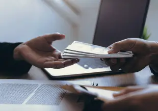 a person handing money
