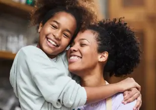 a parent hugging a child