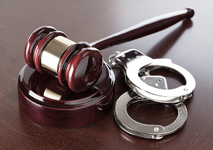a gavel and handcuffs